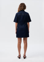 Model wearing the Say the Label Wave Denim Dress, back view