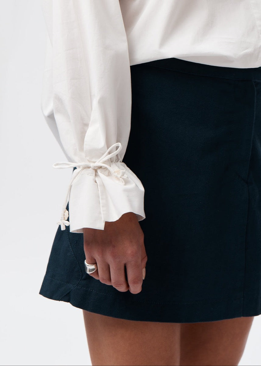 A soft tie cuff at the wrist